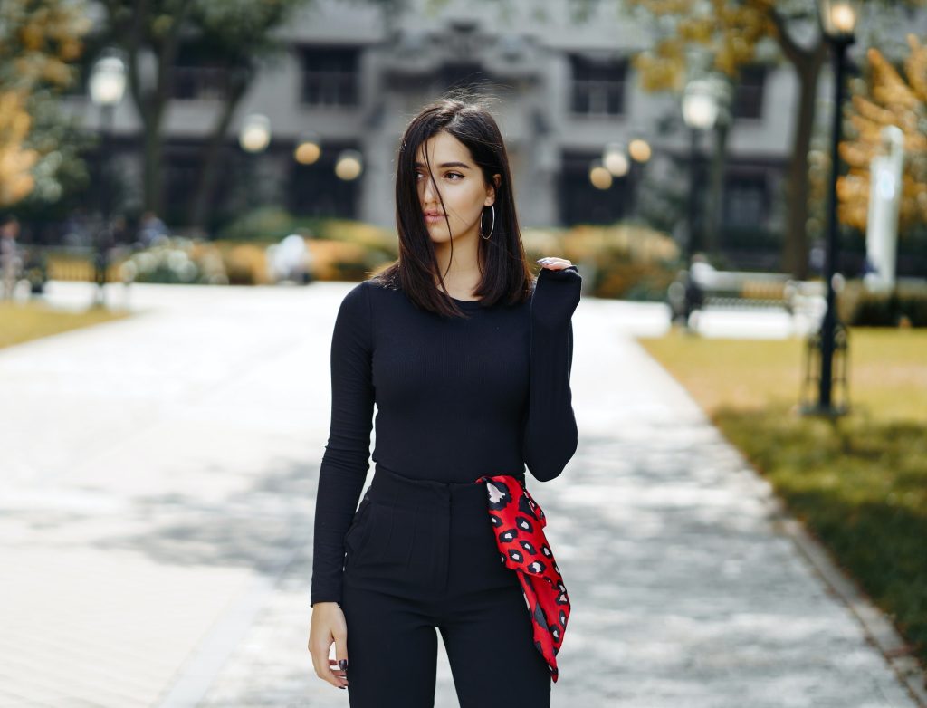 stylish girl walking through her school's campus